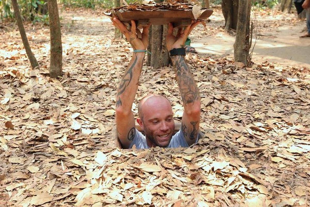 a man laying on the ground with his hands in the air