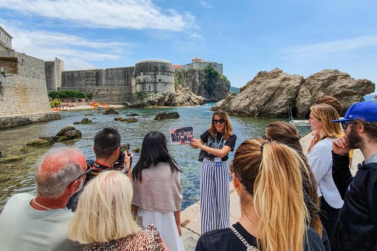 a woman standing in the water with a group of people