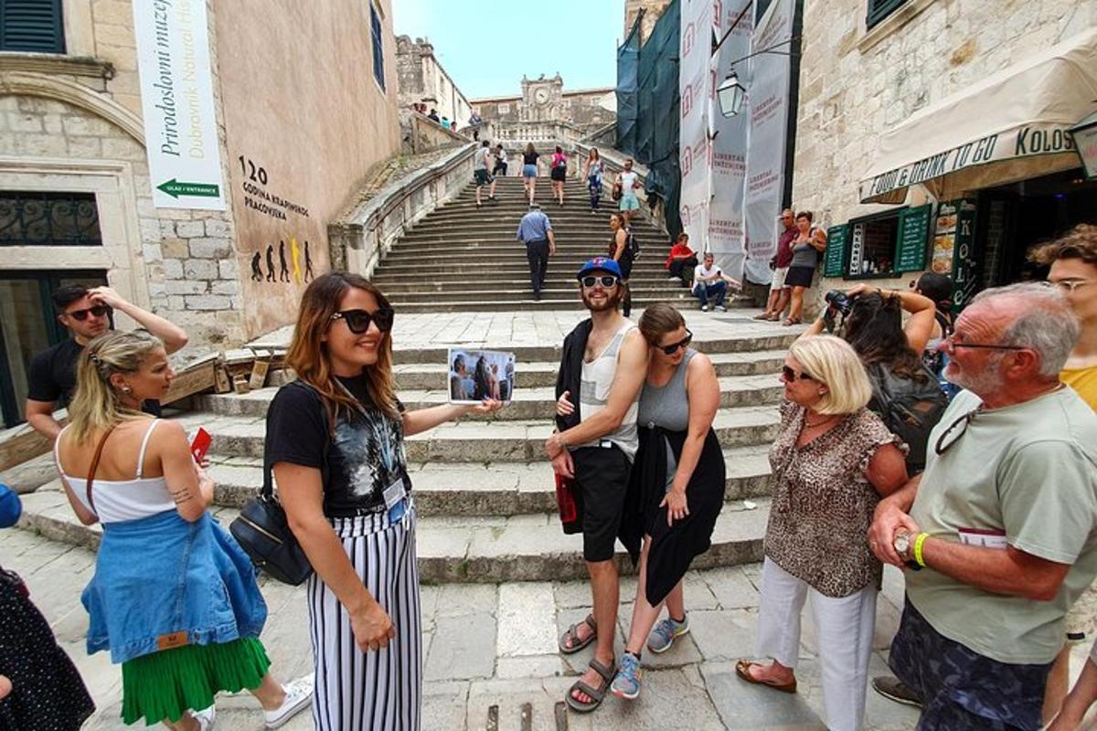 a group of people standing on the steps of a staircase