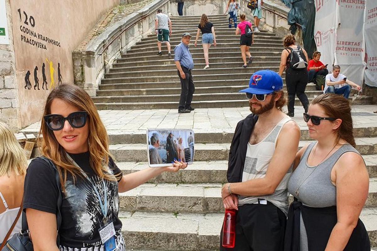 a group of people standing on steps near some stairs