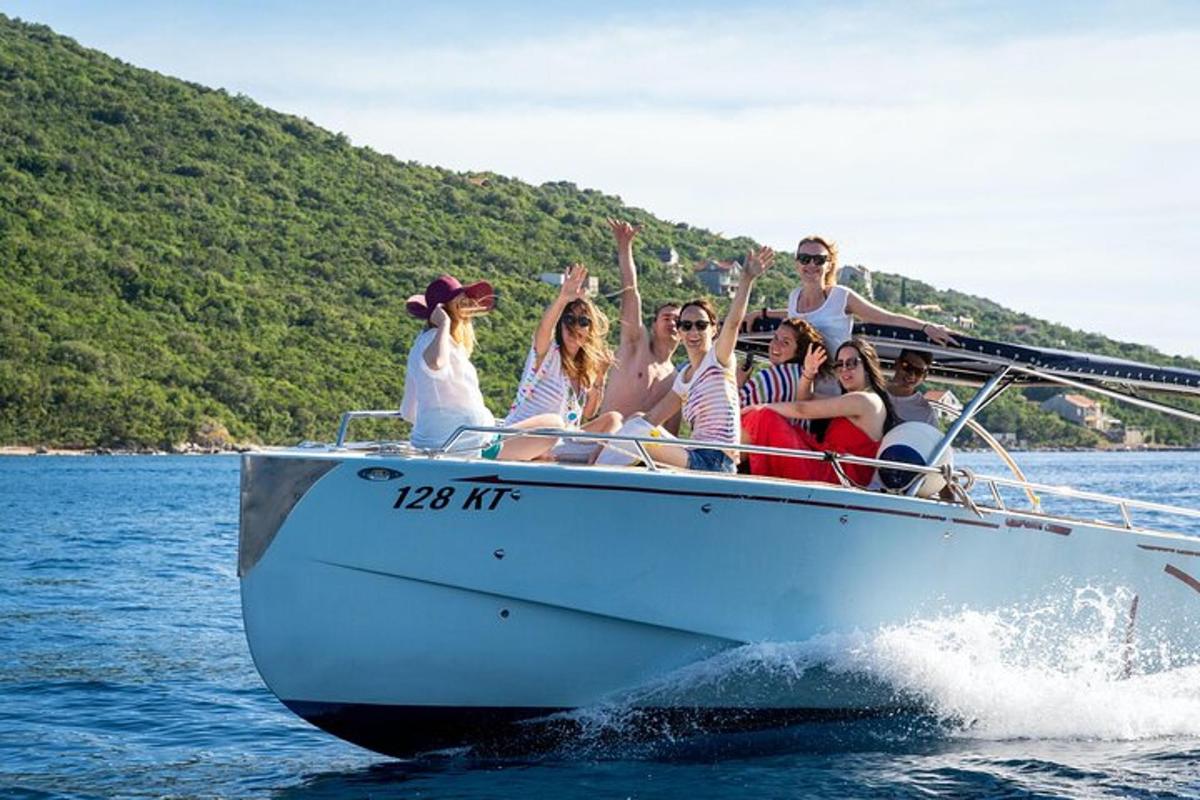 a group of people on a boat in the water