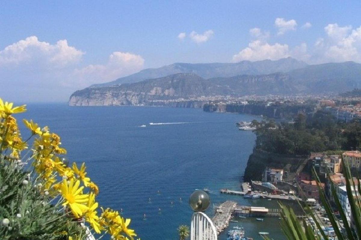 a view of a large body of water with mountains