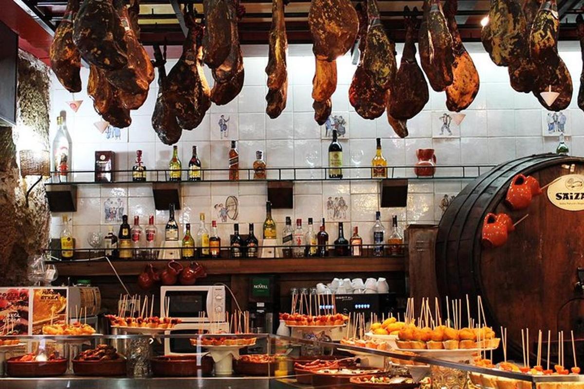a restaurant with meat hanging from the ceiling