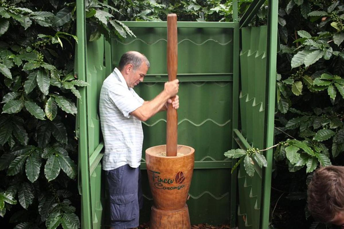 a man standing in a container with a wooden bat