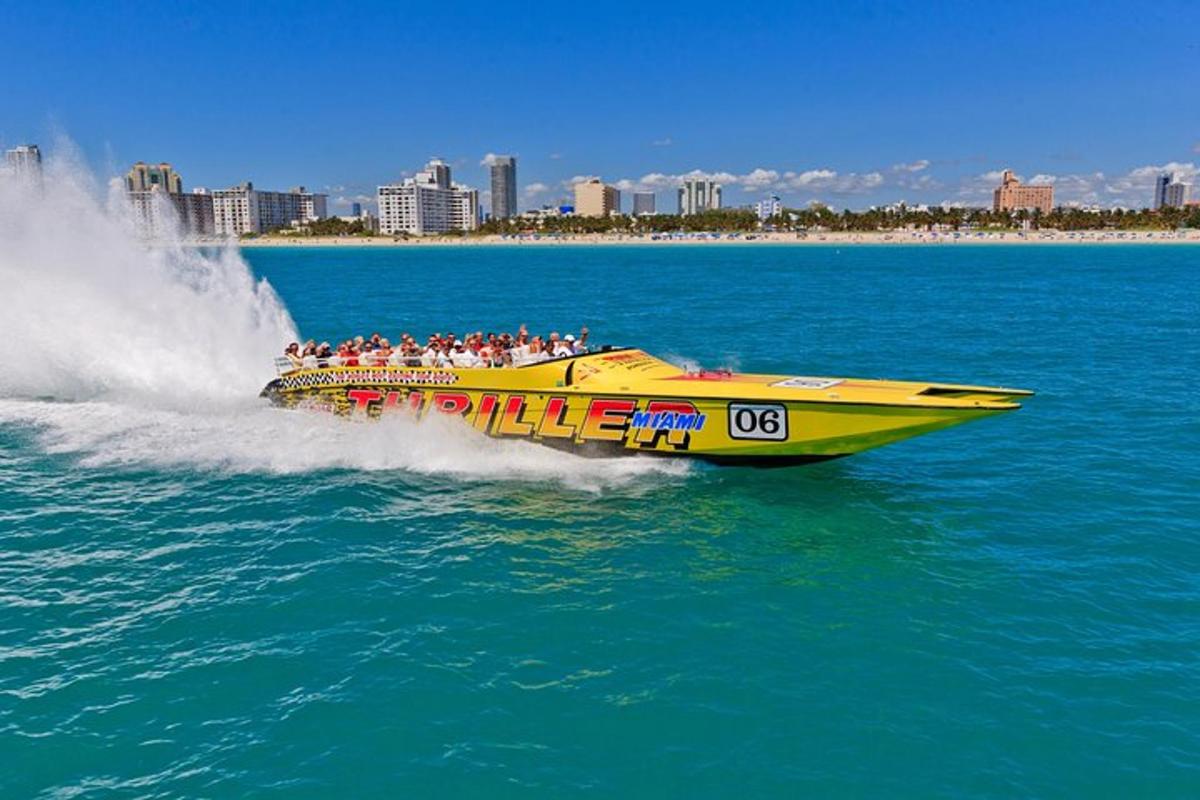 a yellow boat with a bunch of people on it in the water