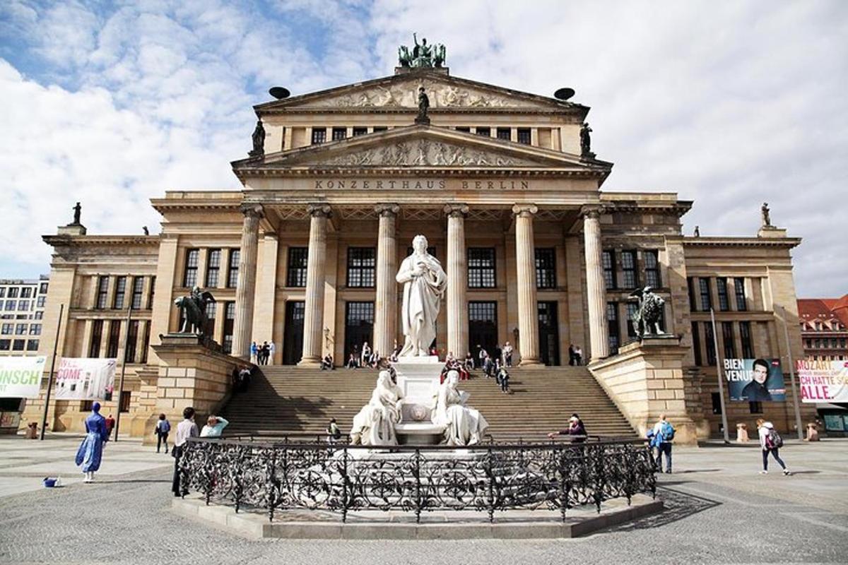 a large building with a statue in front of it