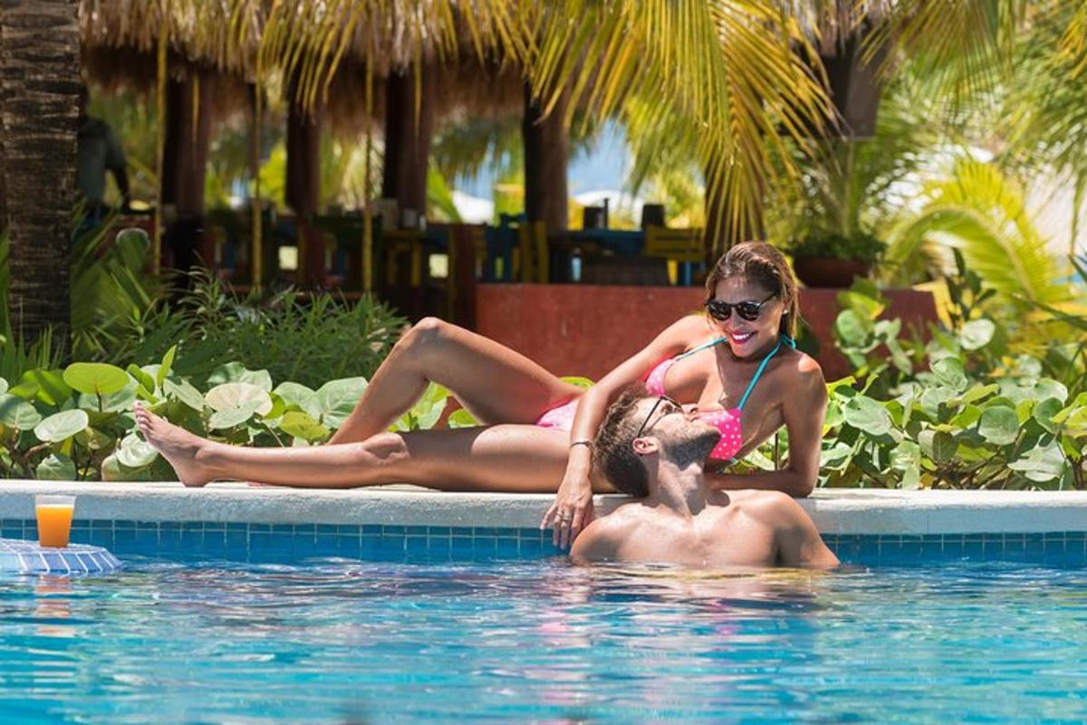 two women are laying in a swimming pool