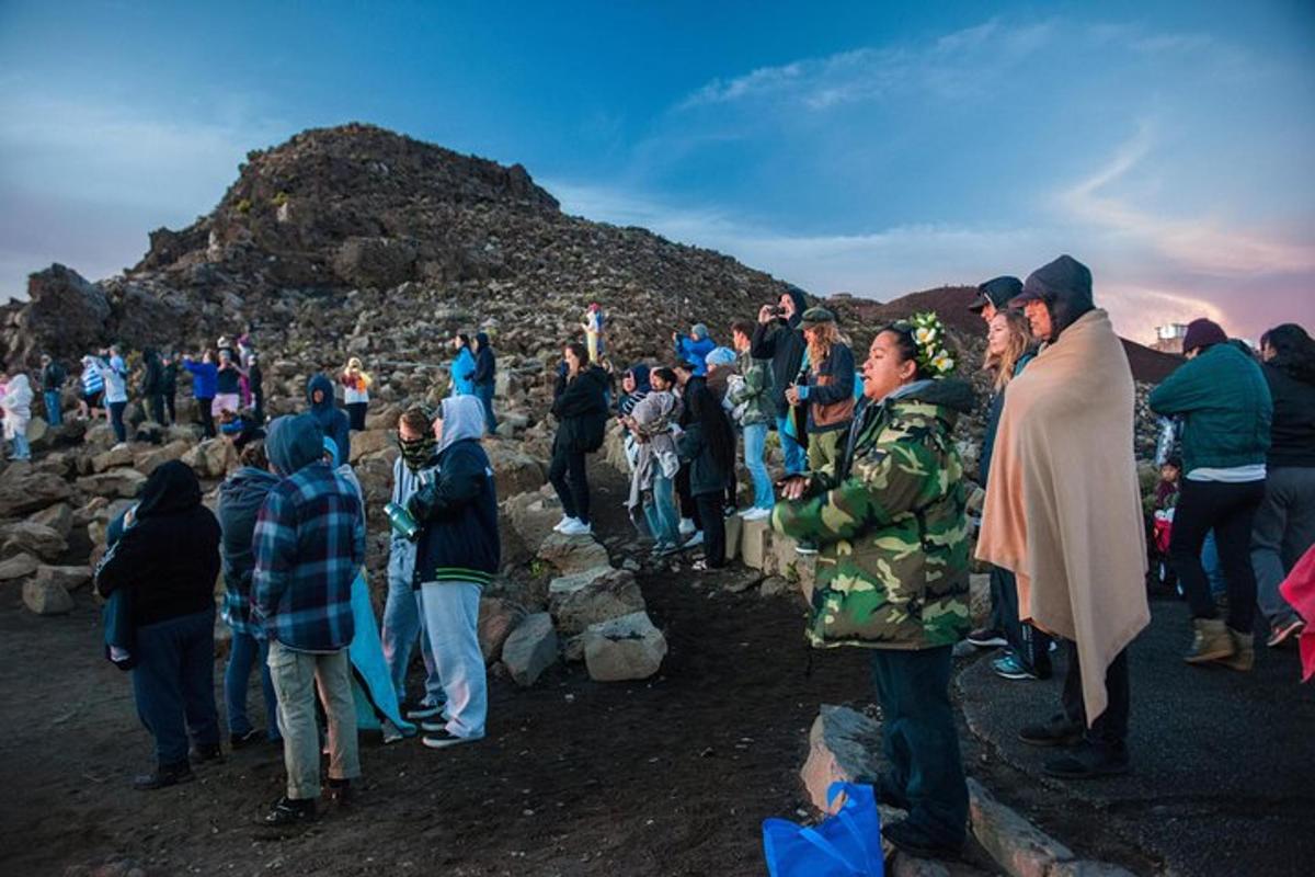 a large group of people standing on a mountain