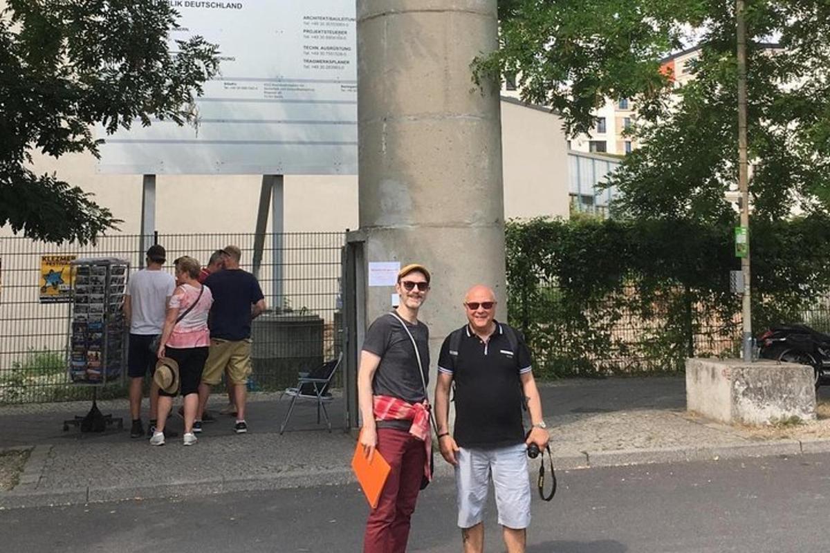 two men are walking down the street