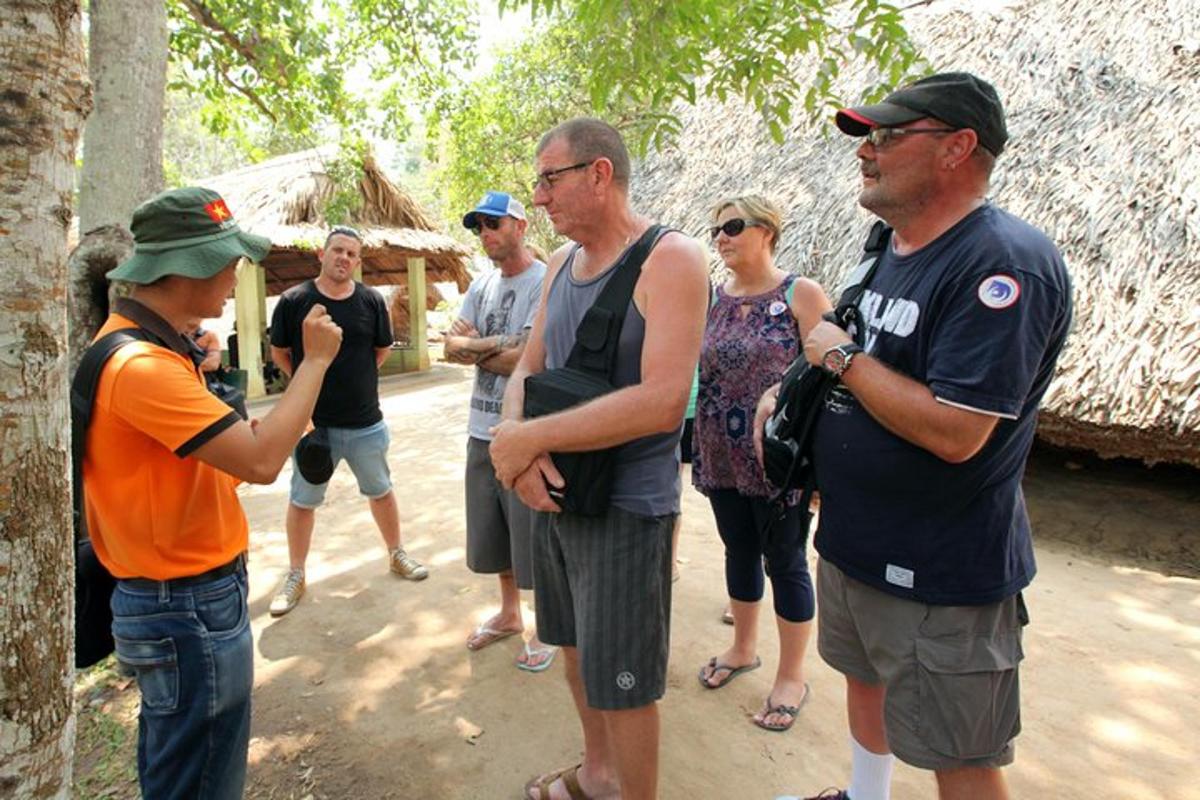 a group of people standing next to a tree