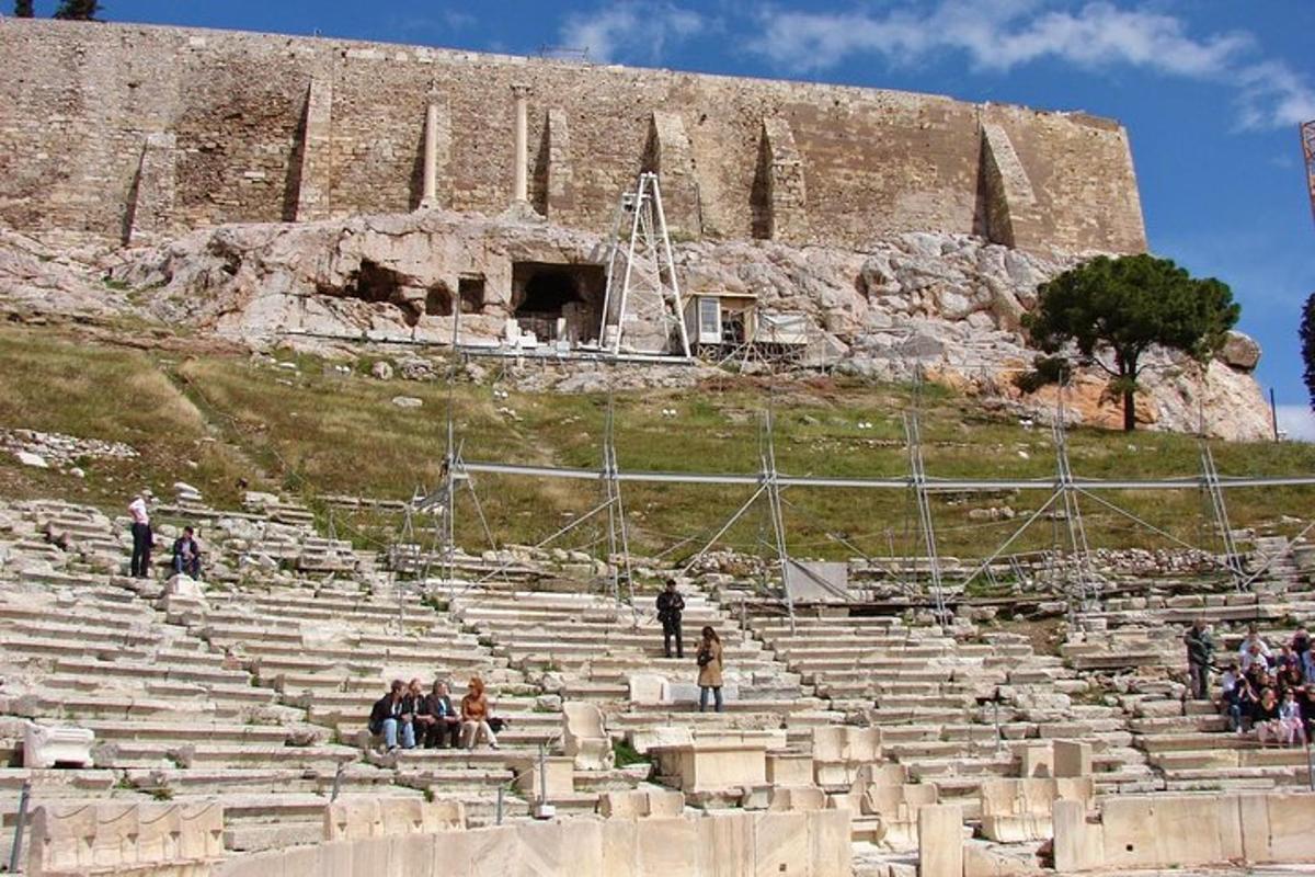 a group of people sitting in an amphitheater