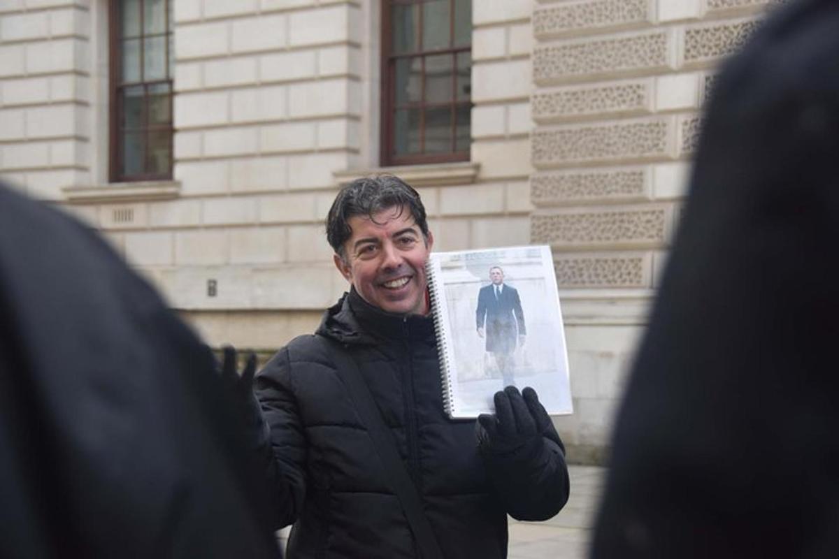 a man holding a paper with a picture of a man