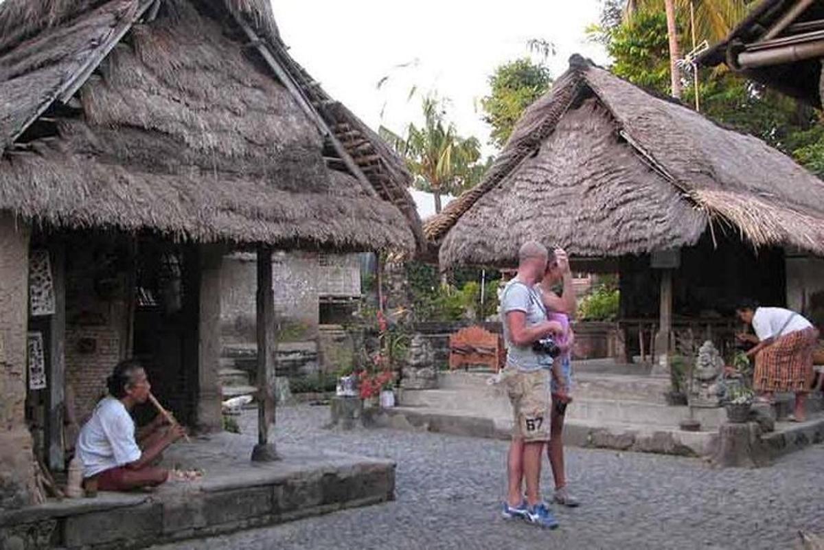 a man and a woman standing in front of a building