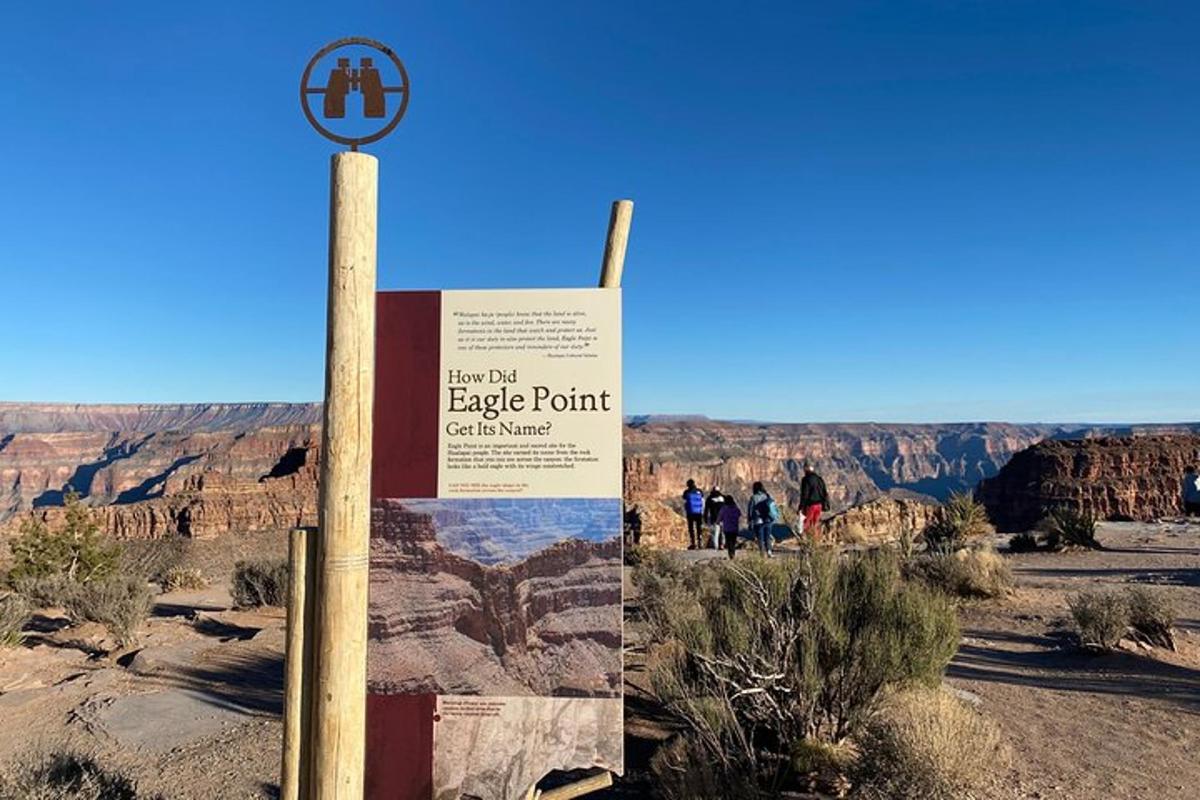 a sign at the edge of the grand canyon