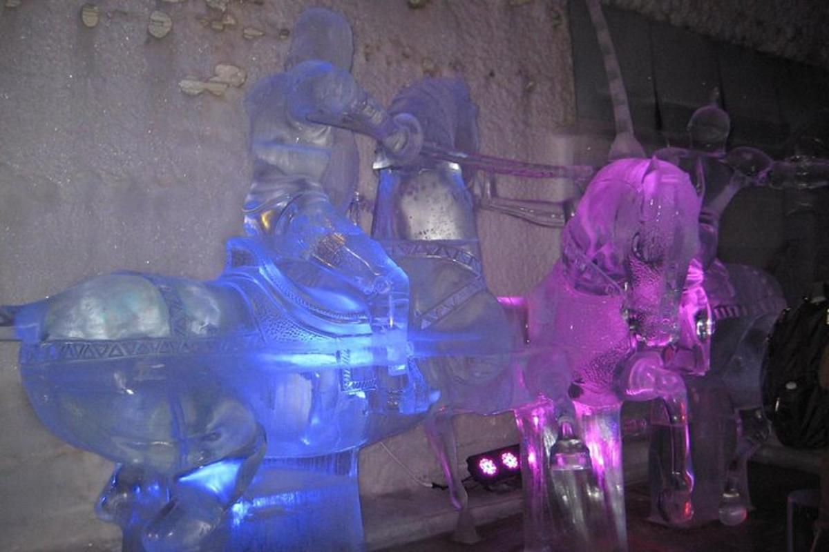a blue and pink glass sculpture of a horse