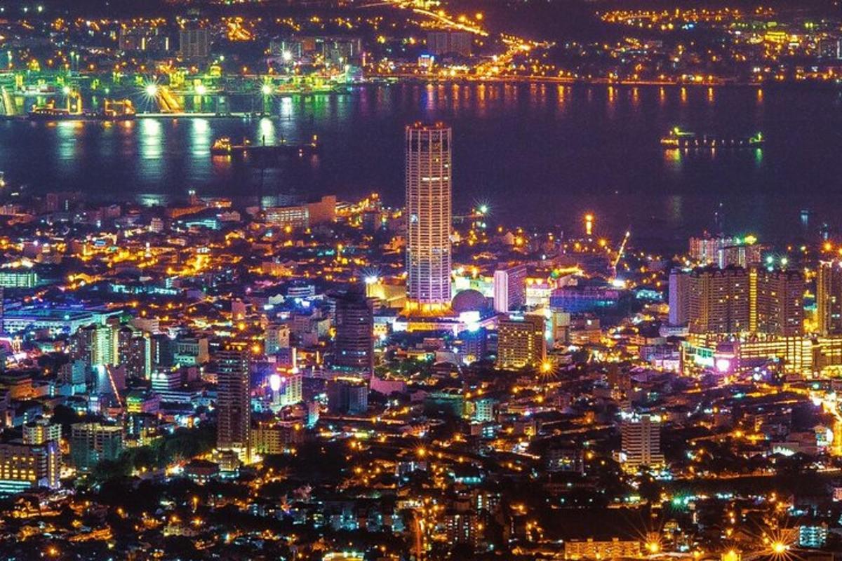 a view of a city at night with the water