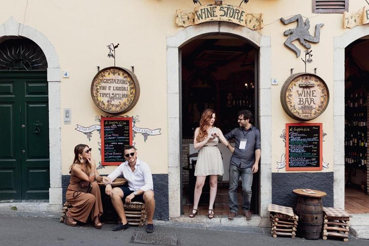 a group of people sitting outside of a building
