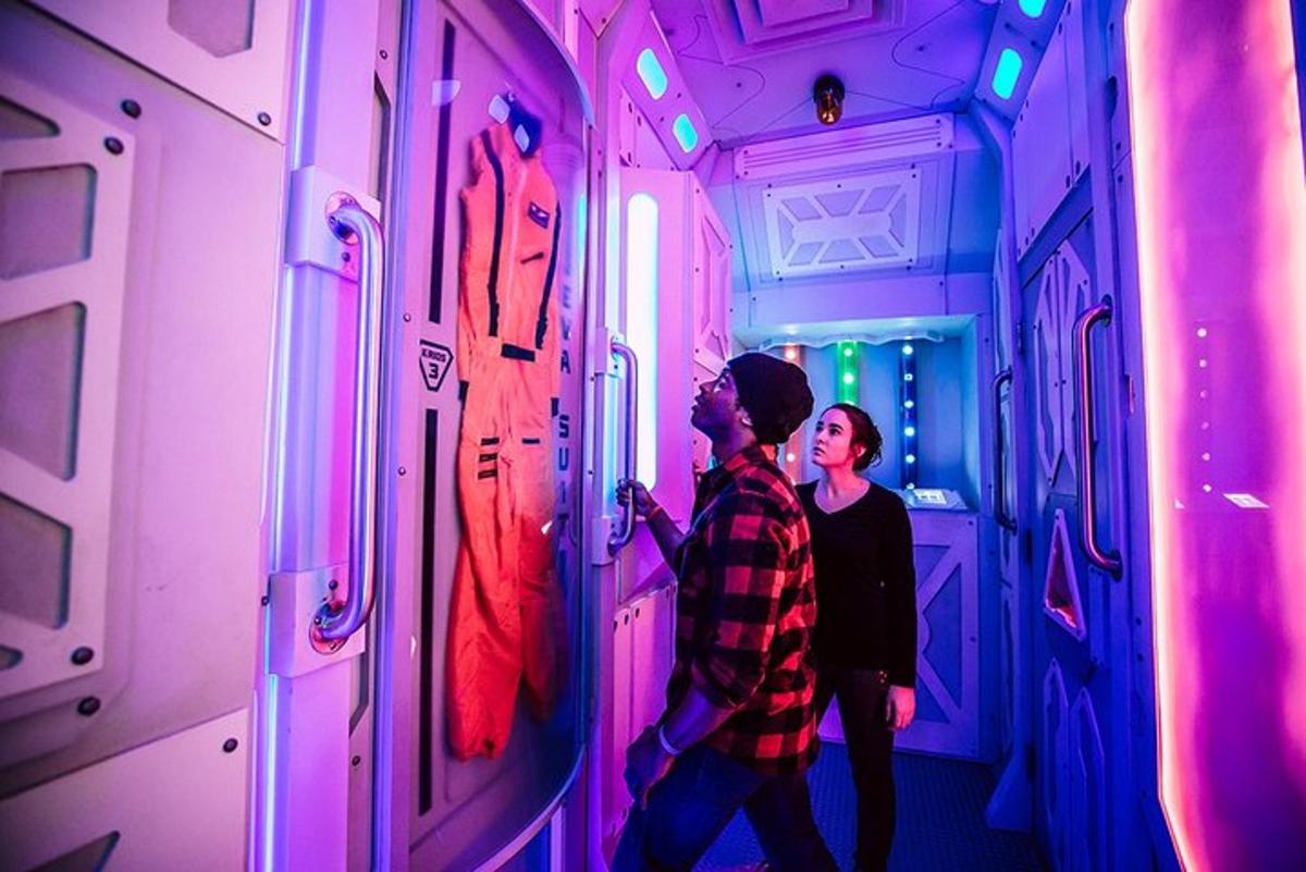 a man and a woman looking at a display in a room