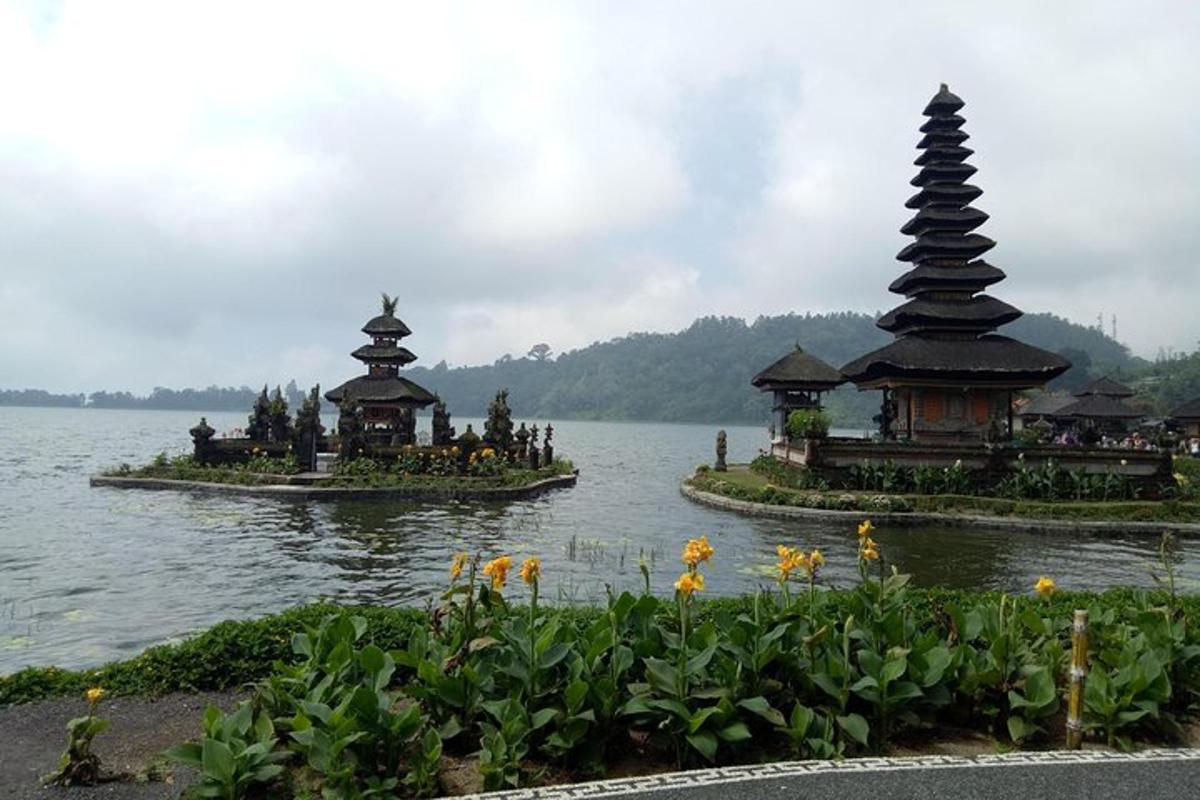 two islands in a body of water with pagodas