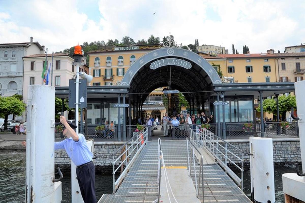 a man standing in front of a bridge