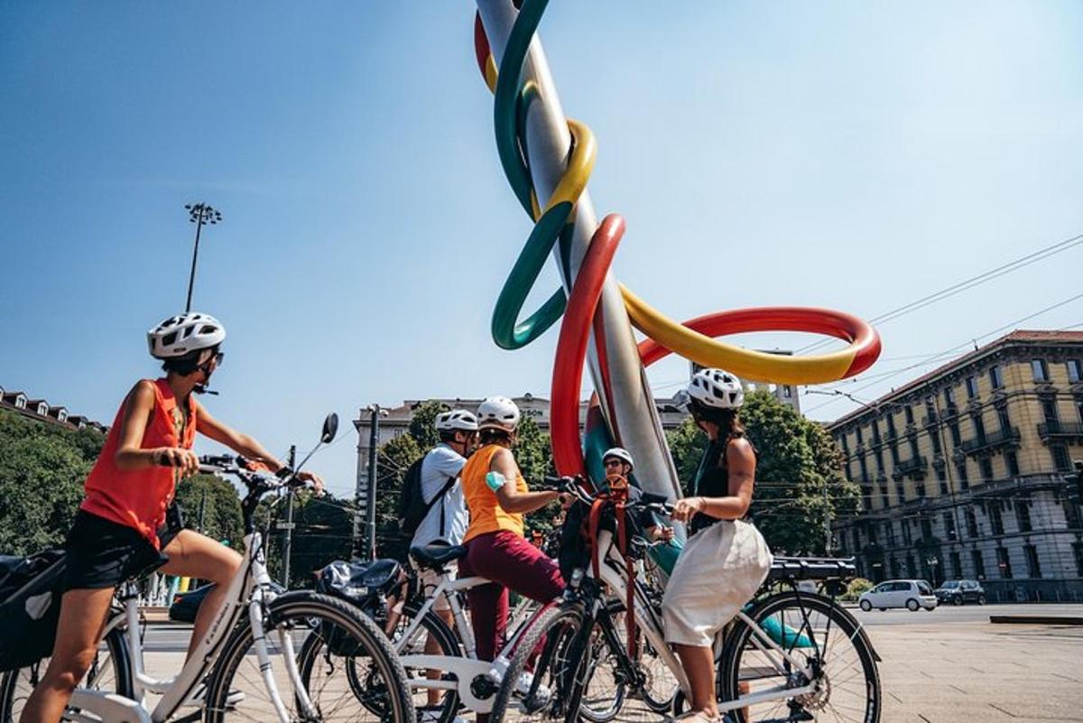 a group of people riding bikes on a street