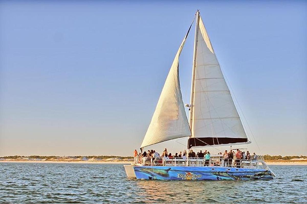 a group of people on a sail boat in the water