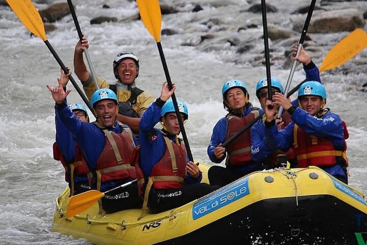 a group of people in a raft in the water
