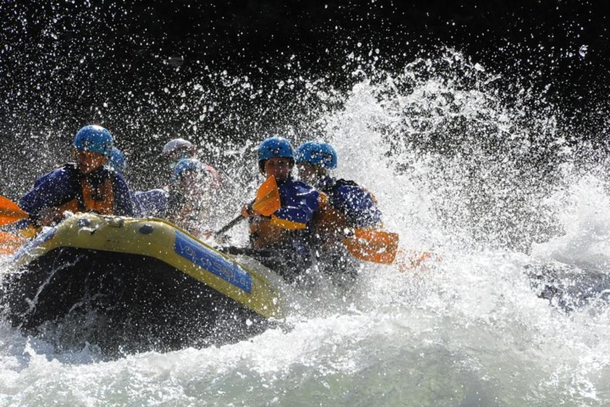 a group of people in a raft in the water