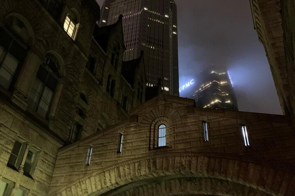 a view of a building at night with skyscrapers