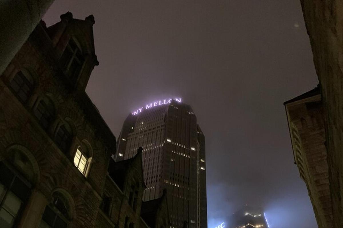 a tall building with lights on top of it at night