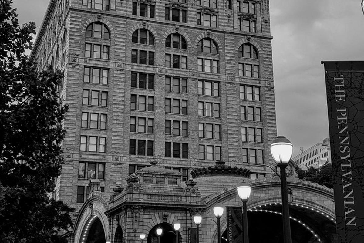 a large brick building with many windows and street lights