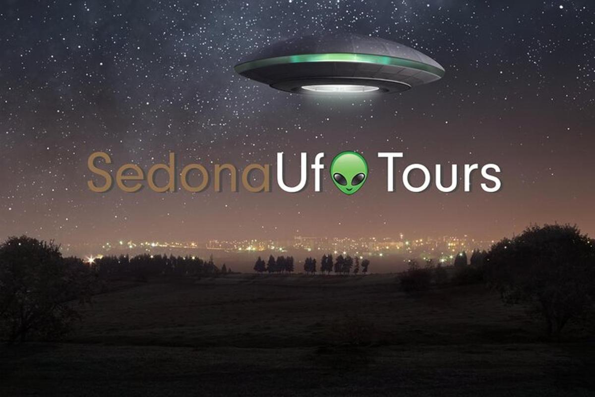 a ufo flying over a field at night