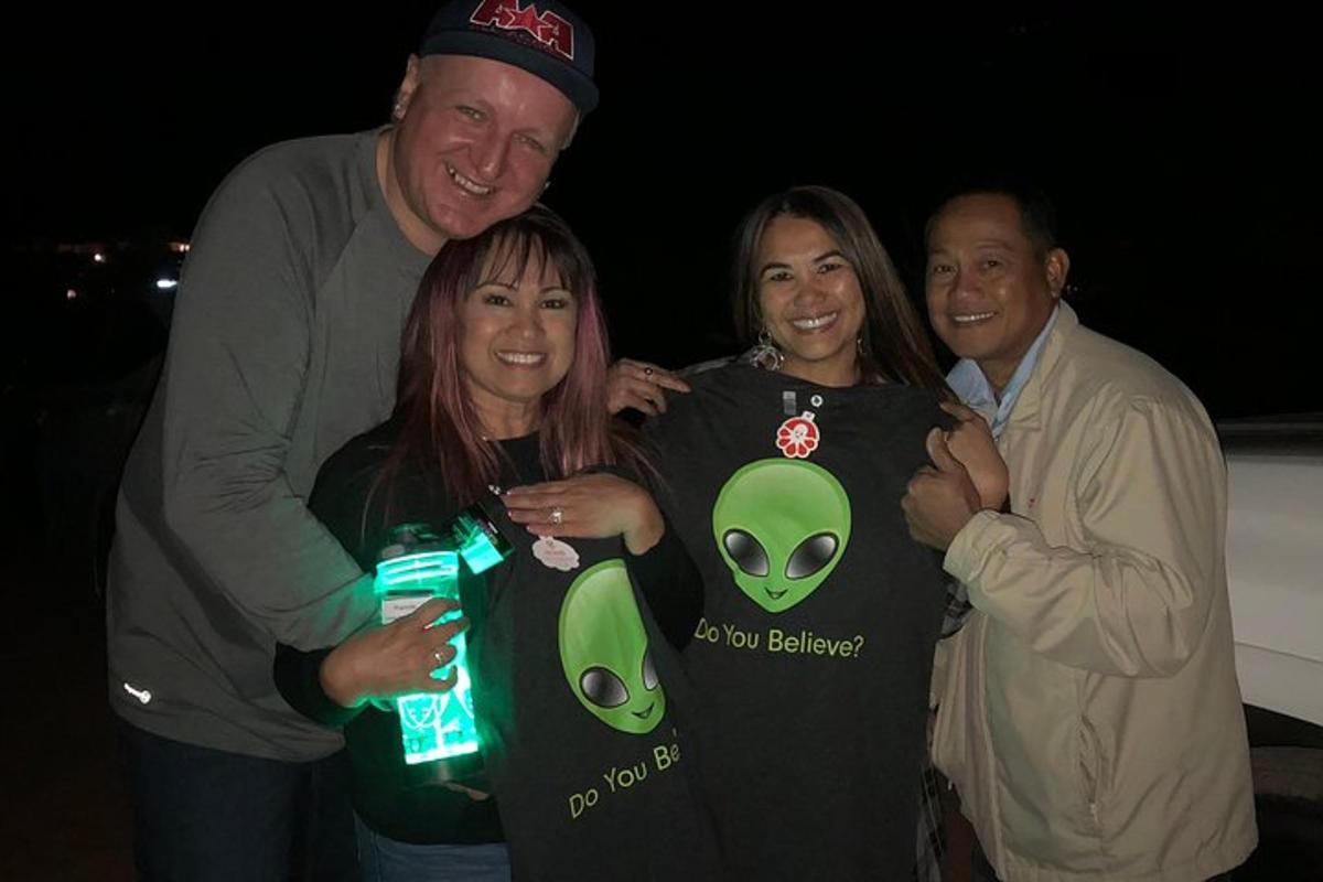 a group of three people posing for a picture