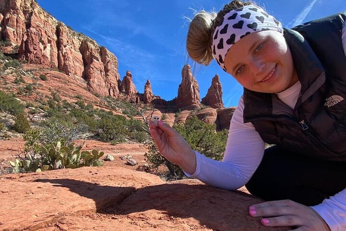 a woman laying on the ground in the desert