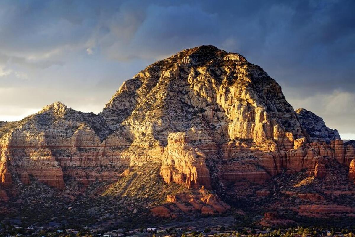a mountain with a city in front of it