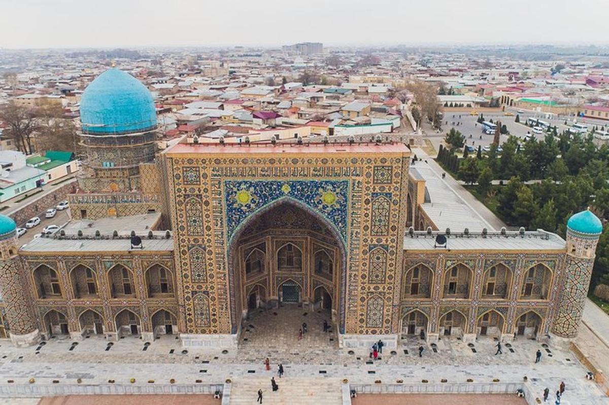 an aerial view of a building with a mosque