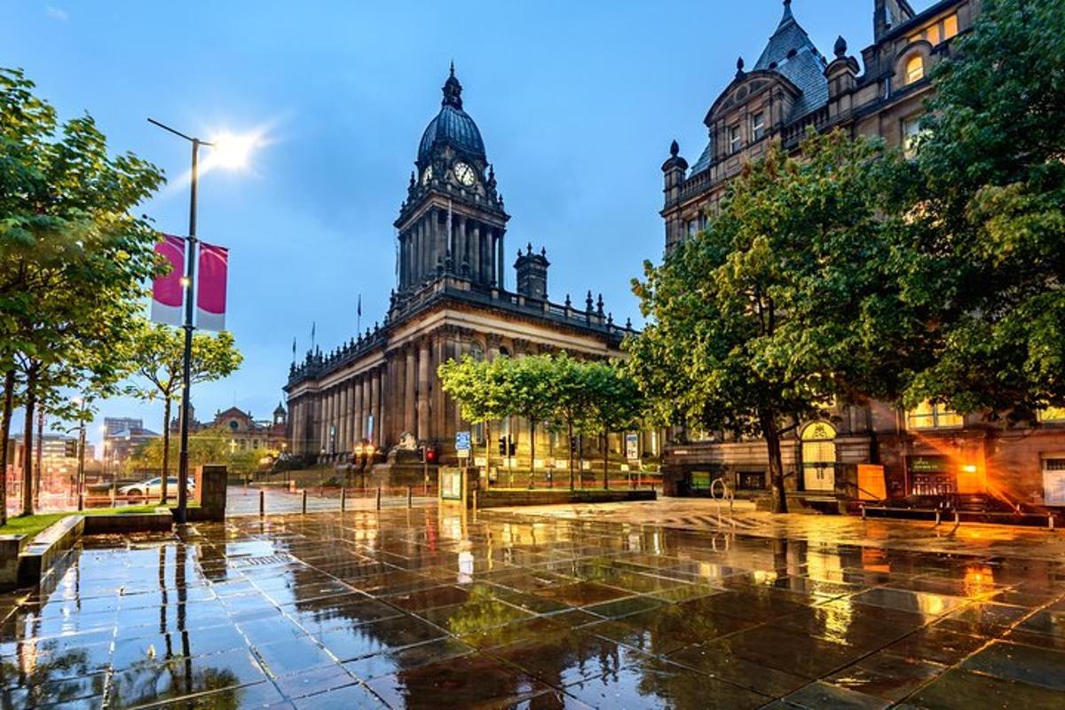 a large building with a clock tower in a city
