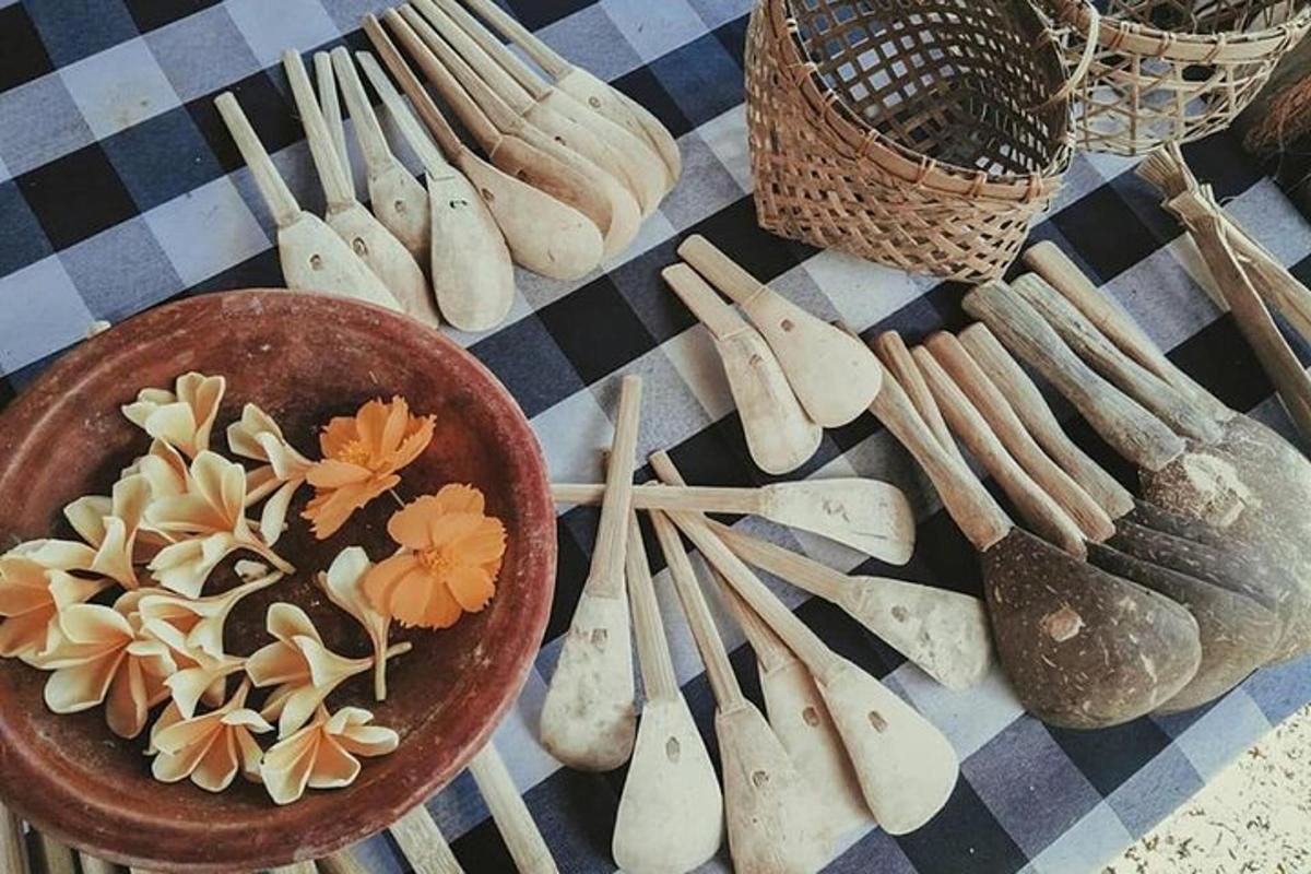 a table with wooden utensils and a plate of food