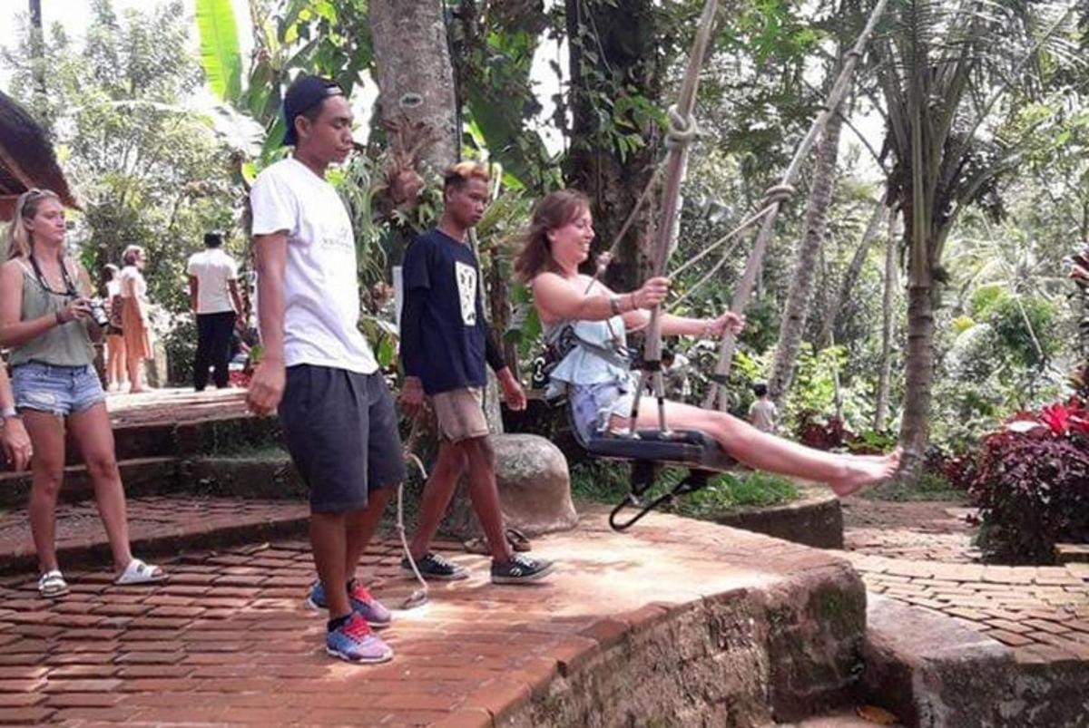 a group of people standing around in a park