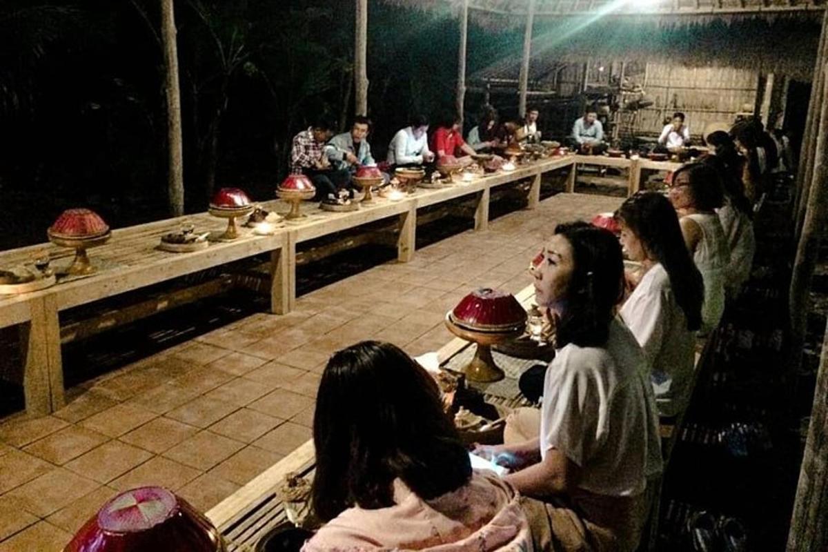 a group of people sitting in a room with bowls