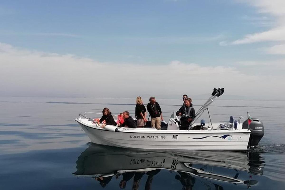 a group of people in a boat on the water