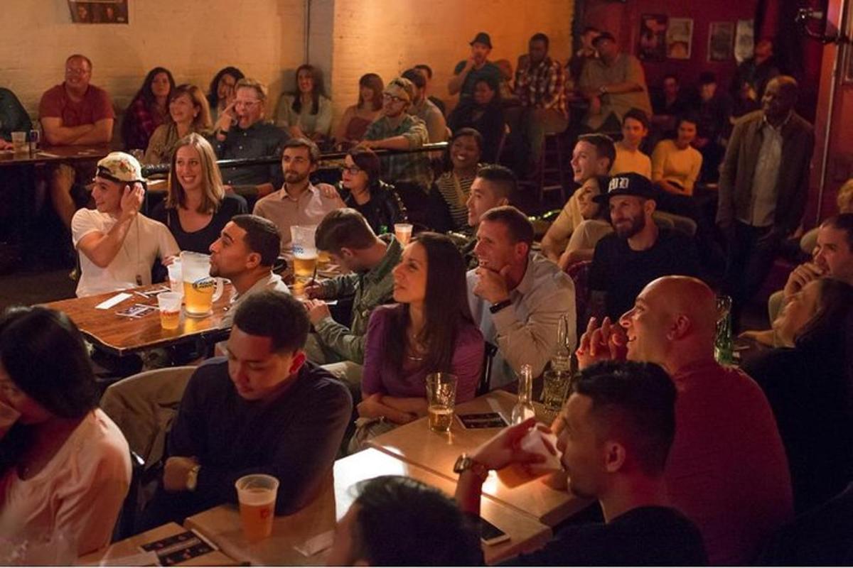 a group of people sitting at tables in a room