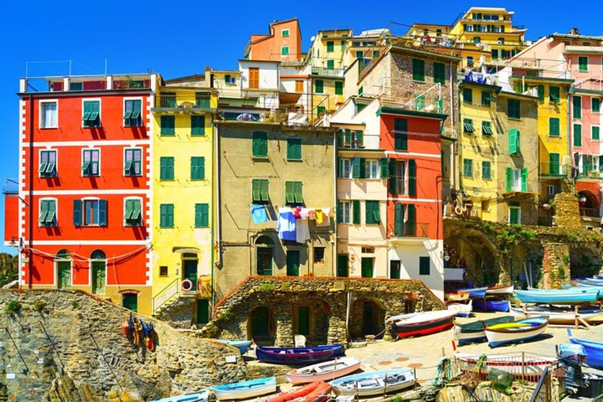a group of buildings with boats in a harbor