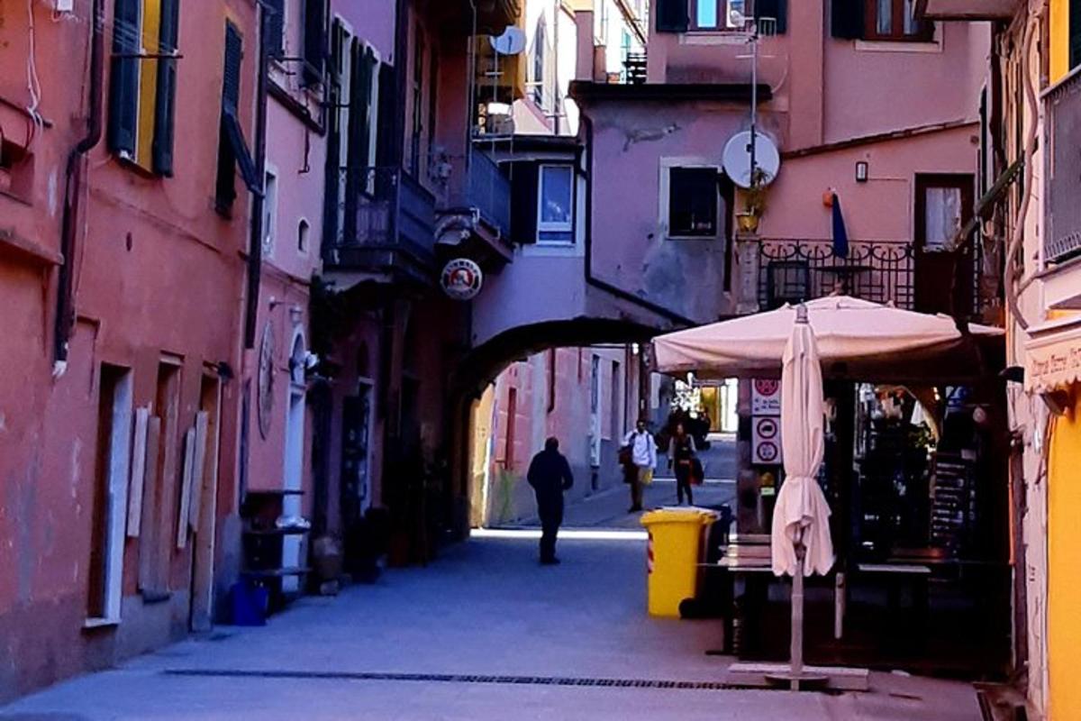 a person walking down a street with an umbrella