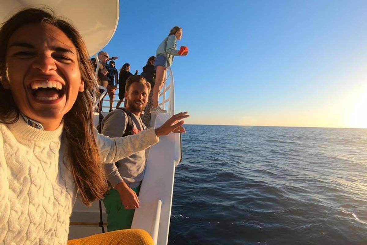 a group of people on a boat in the water