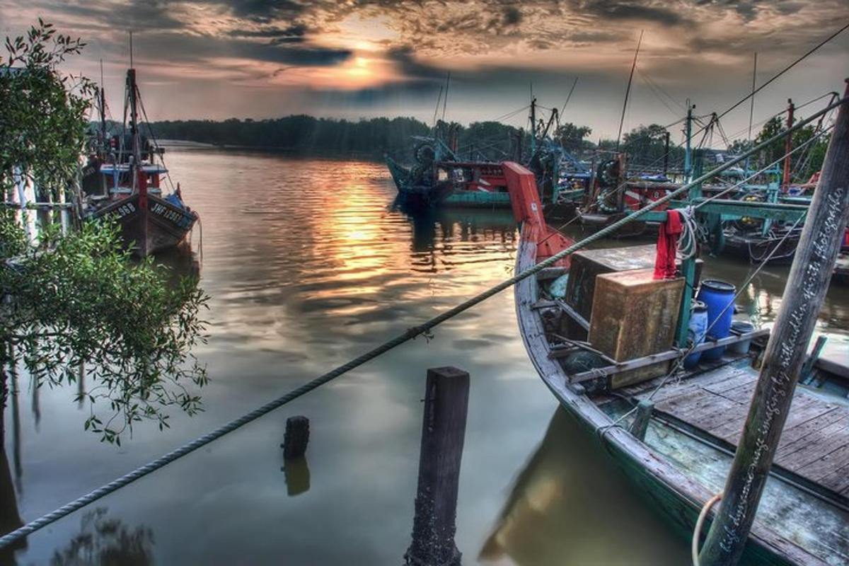 a group of boats docked at a dock in the water
