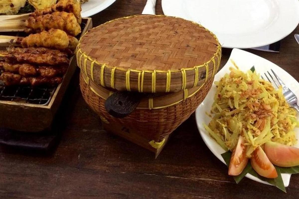 a table with plates of food and a basket of food