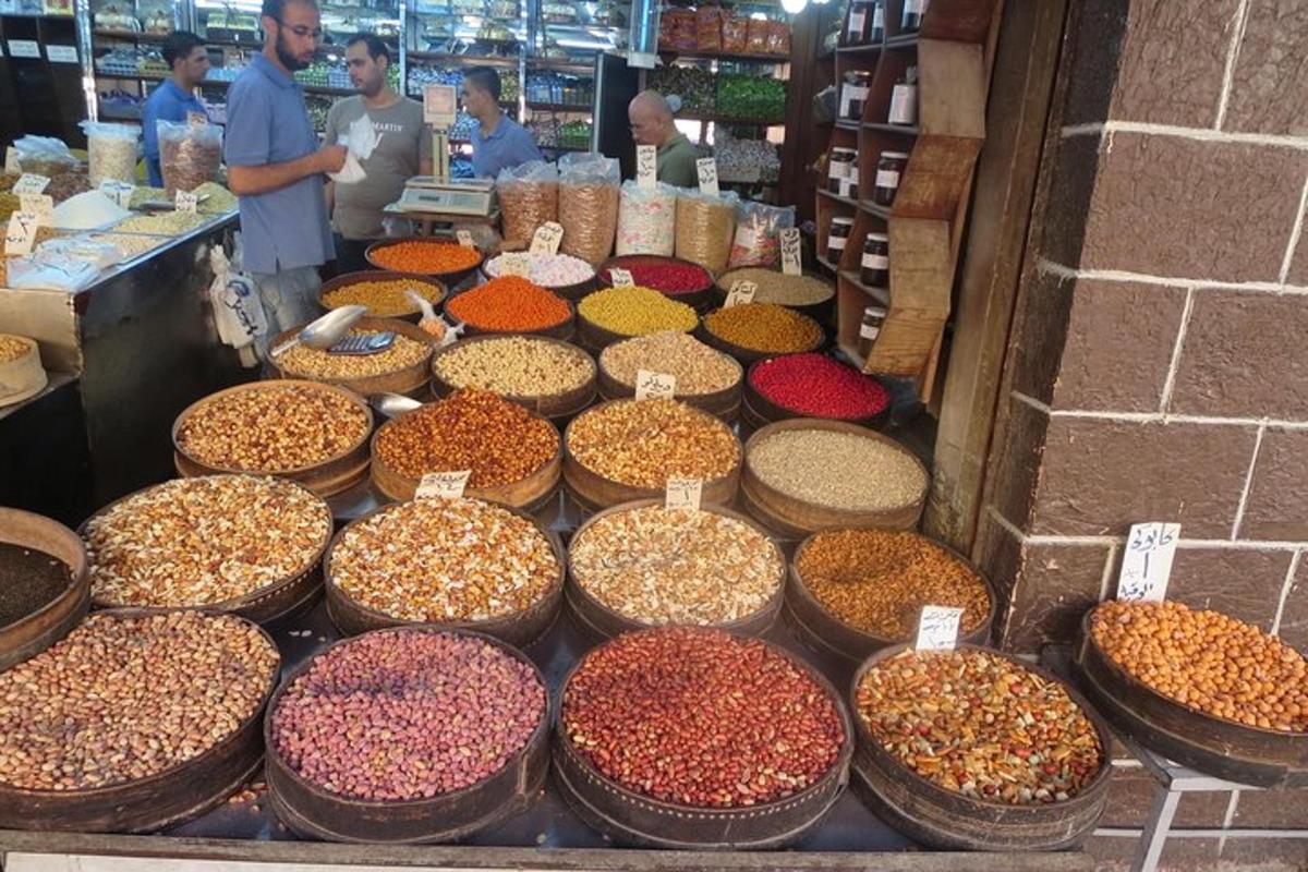 a display of different types of nuts in baskets in a store