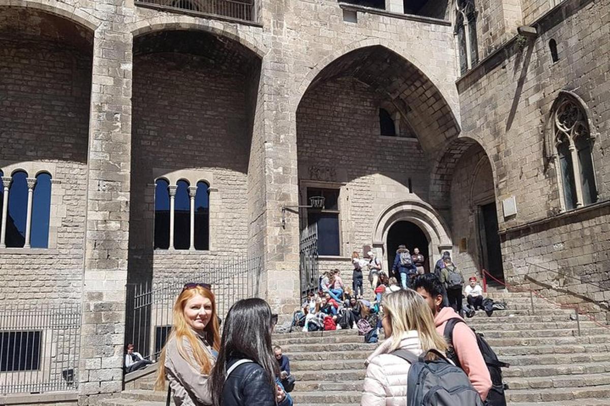a group of people sitting on the steps of a building