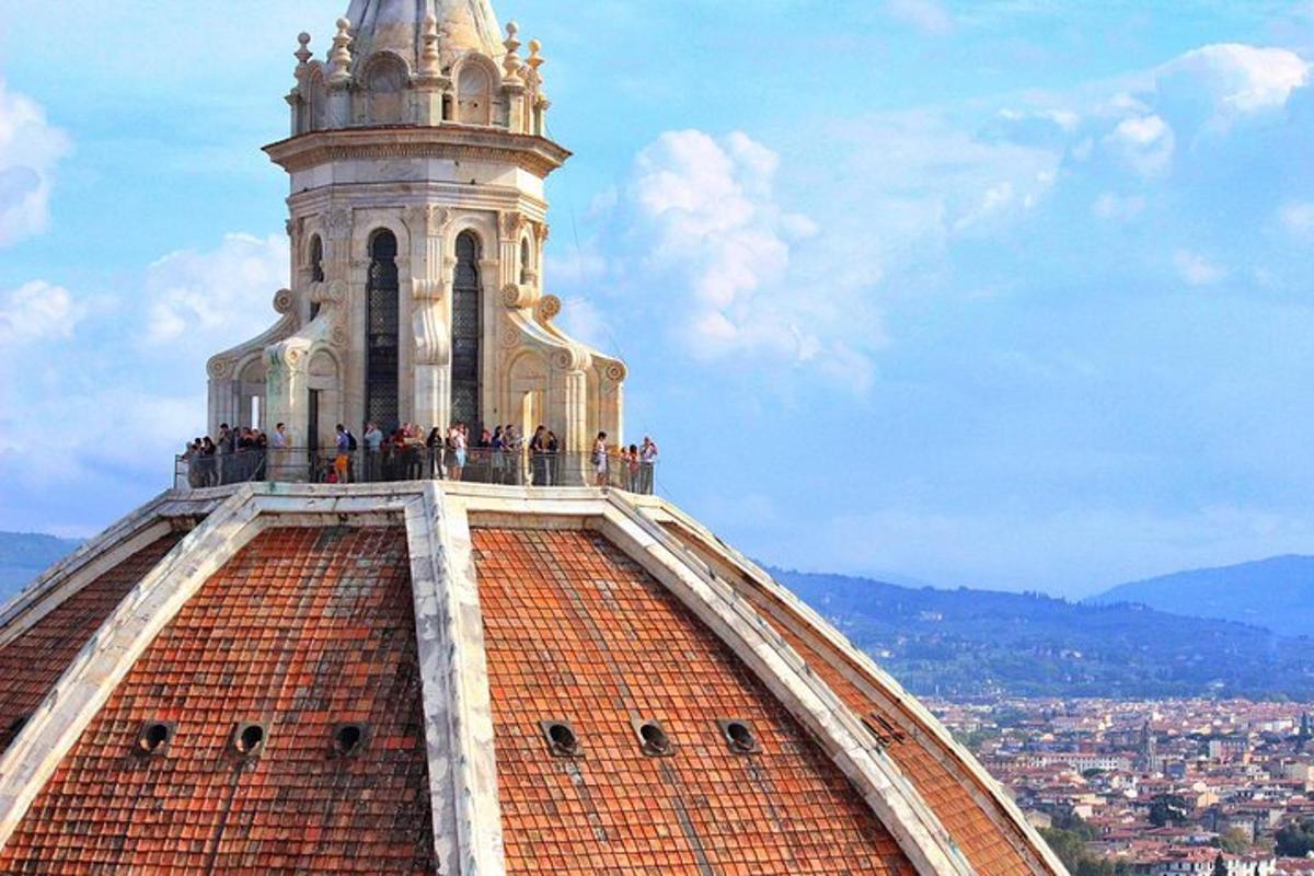 a group of people standing on top of a tower